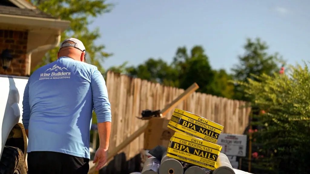 a project manager inspecting roofing materials