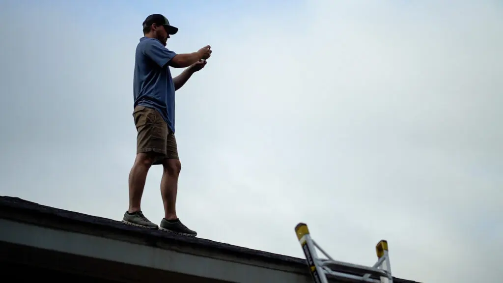 a wise builders roofer finding out how much damage is on a roof