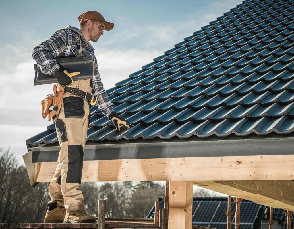 a roofer working on a clay title roof