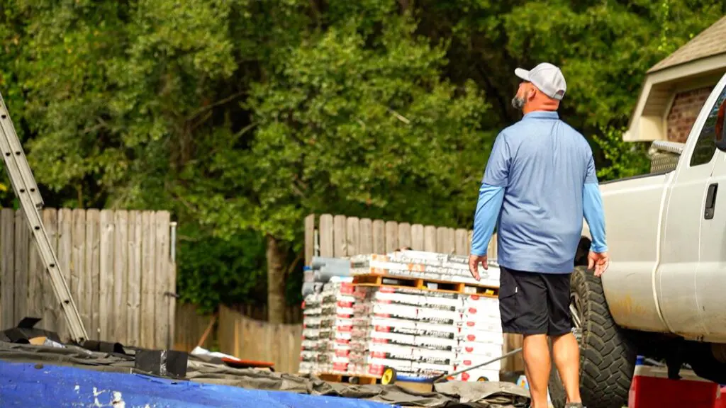 a wise builders roofer watching a new roof install