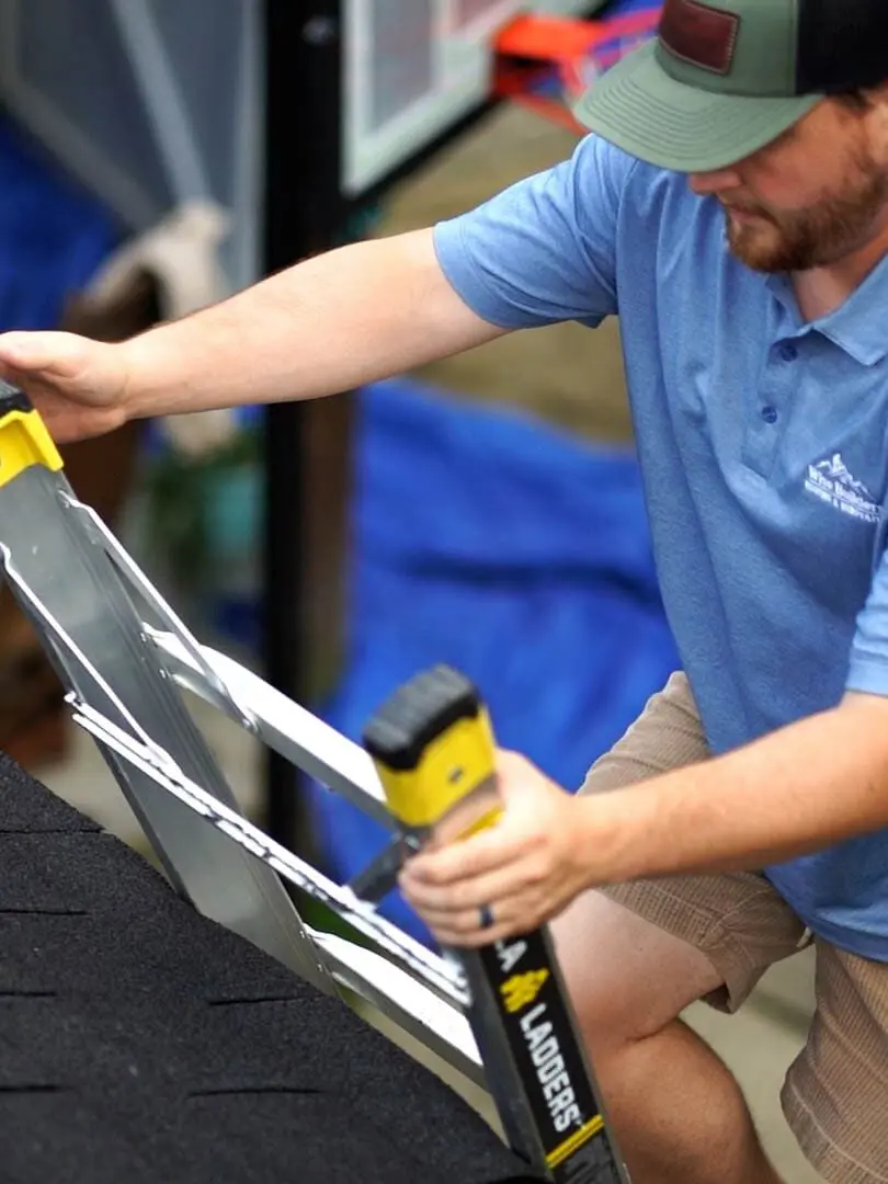 a roofer preparing to help a homeowner by providing a free roof inspection