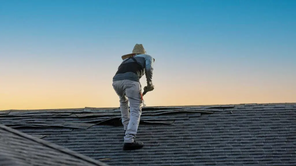 a worker who works on metal roofs