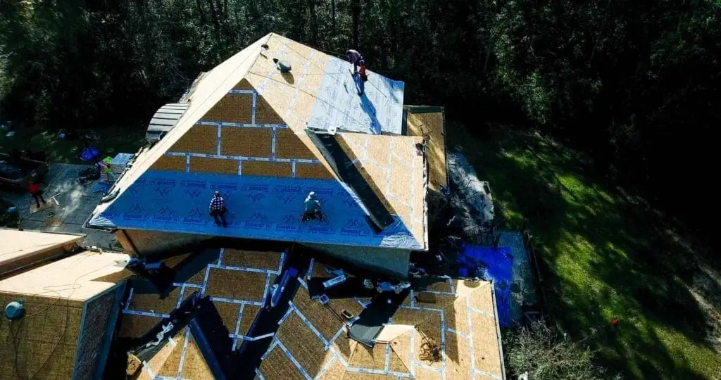 A Wise Builders Roofing and Renovations project manager during a milestone inspection on a Gulf Coast project