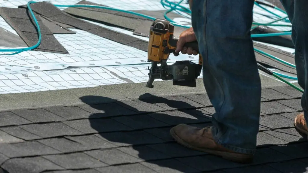 a roofer performing a roof replacment