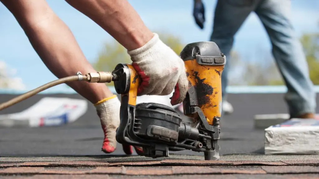 a roofer performing roof repair