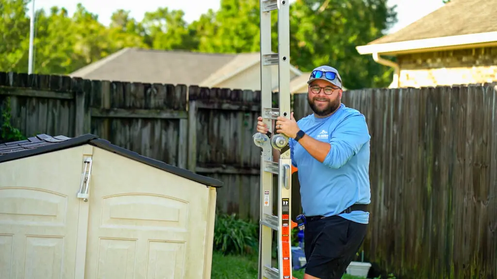 a roofer from wise builders helping with a roof install