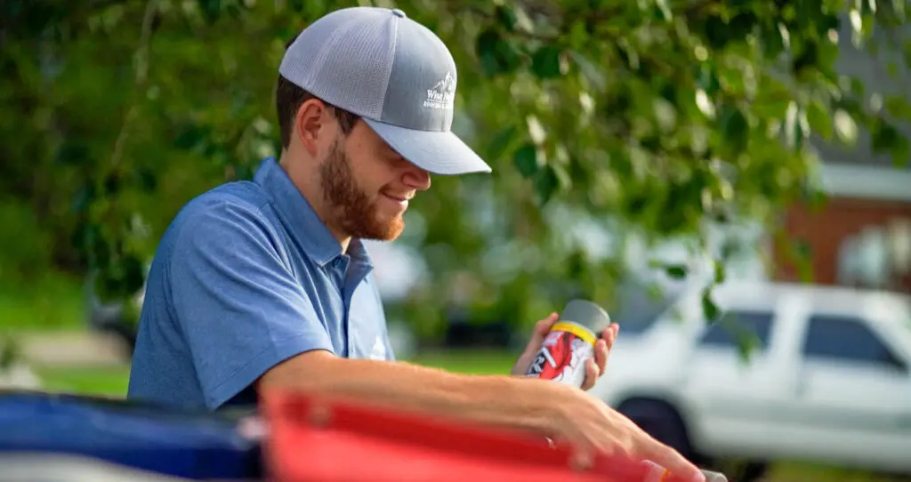 a roll roofing expert looking at materials