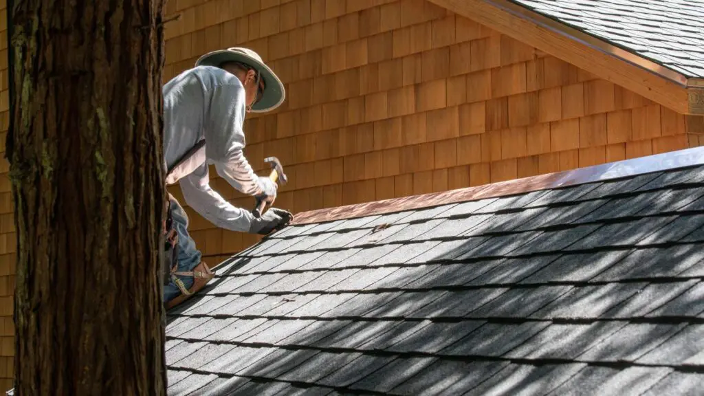 step flashing being installed on a roof