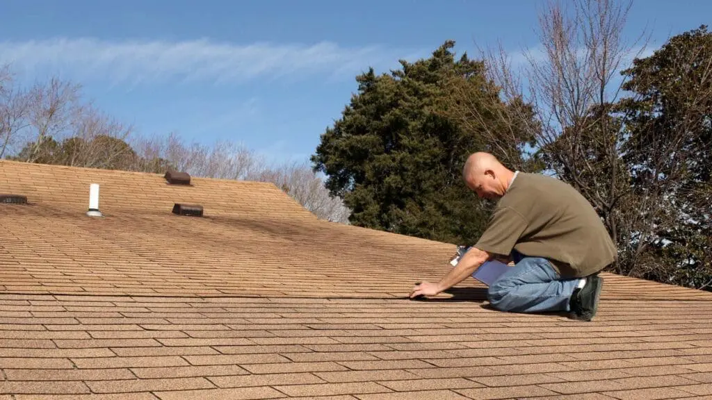 a man on a average roof in the united states