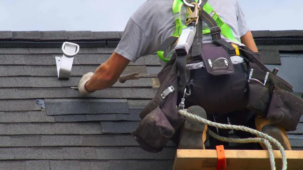a roofer doing roof work