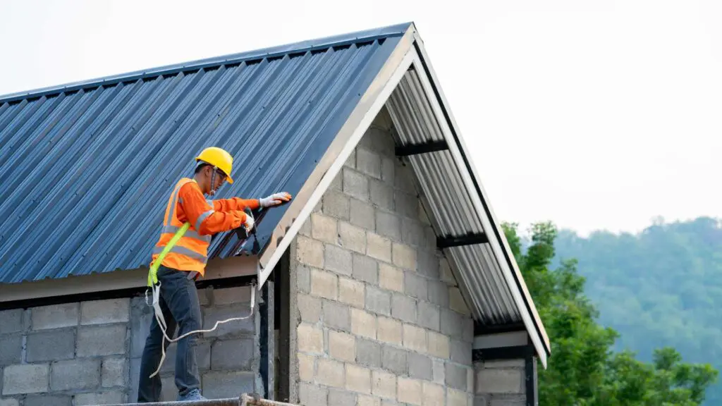 a roofer standing on scaffolding