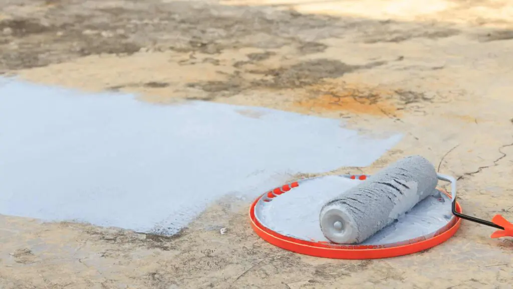 applying a sealer to a roof