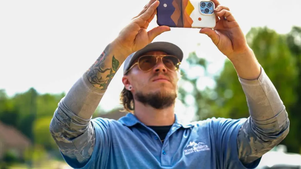 a project manager from wise builders inspecting an old roof