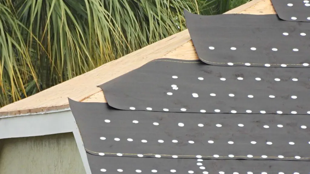 underlayment being installed on a roof