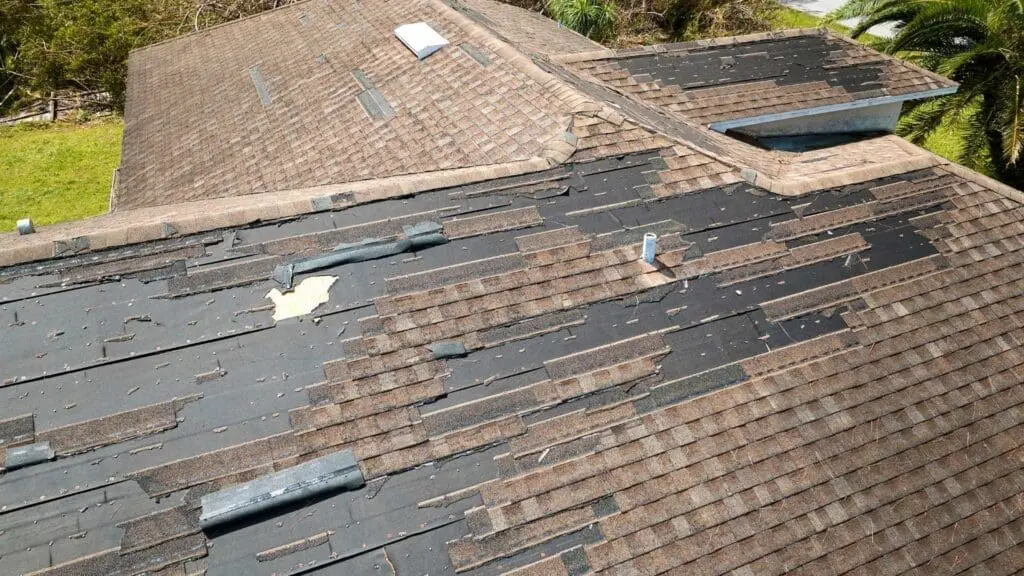 wind damage on a roof and chimney