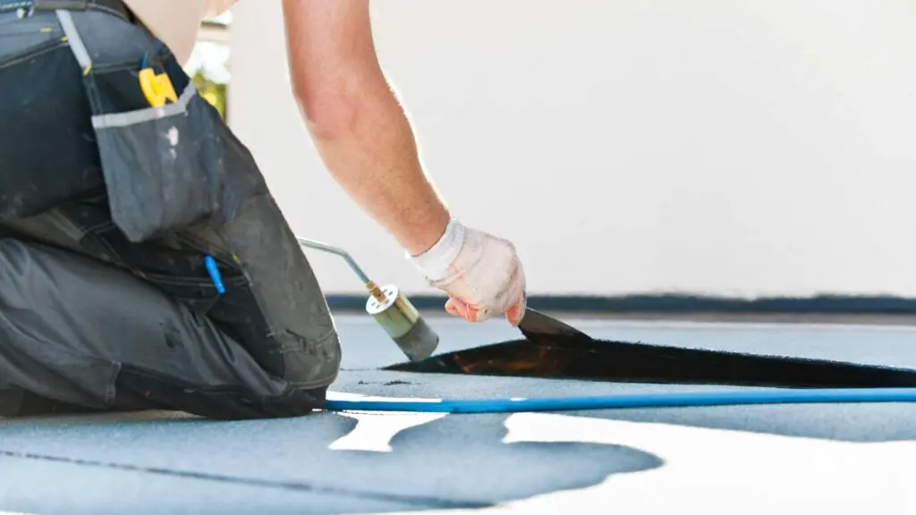 a roofing contractor using a blowtorch