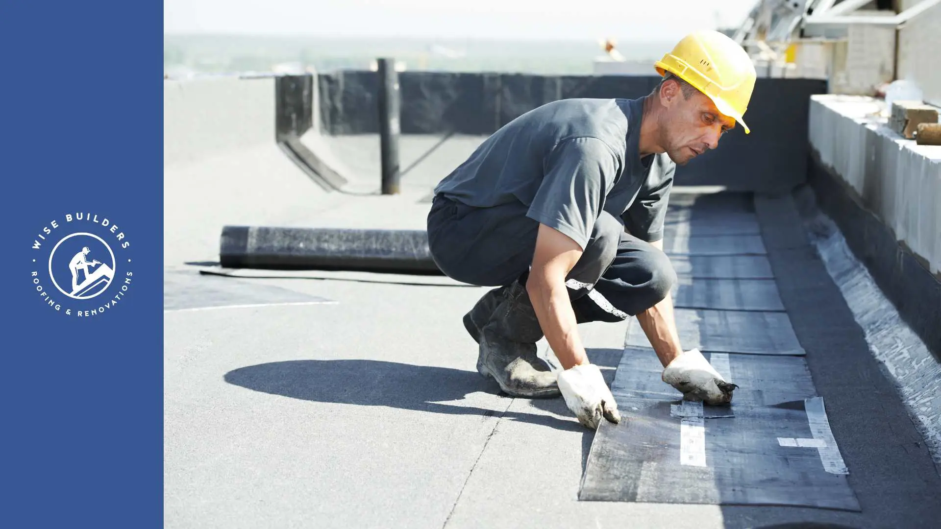 a roofer working on a flat roof in mobile al