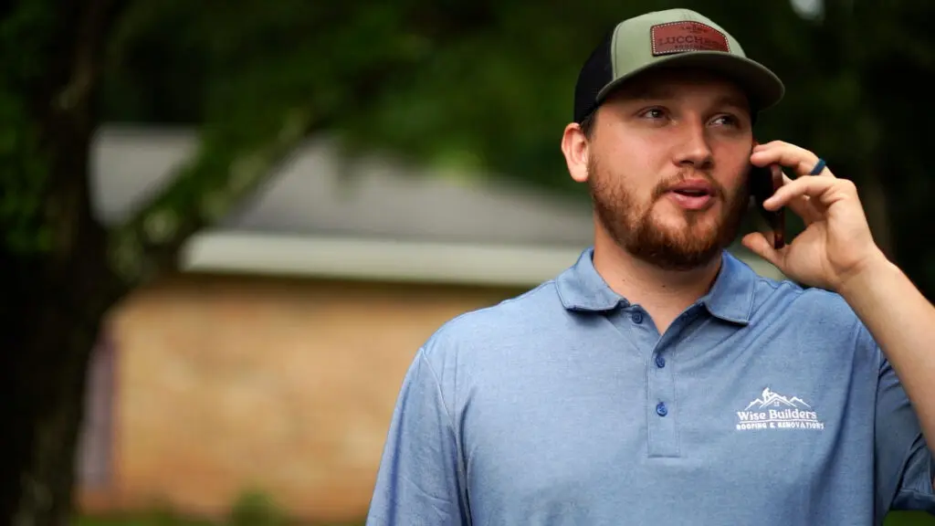 a professional commercial roofing expert on the phone