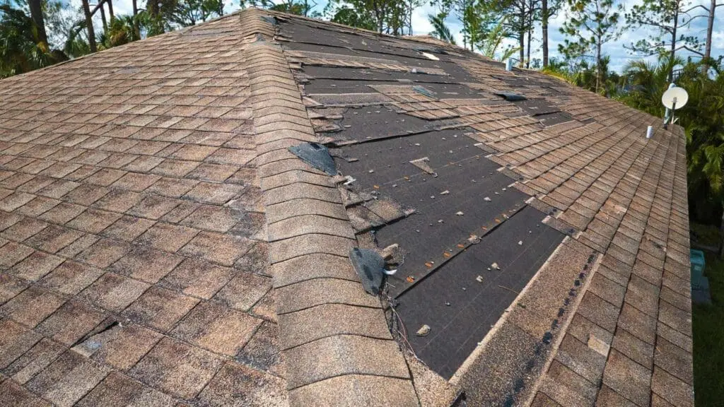 a roof missing shingles from storm damge