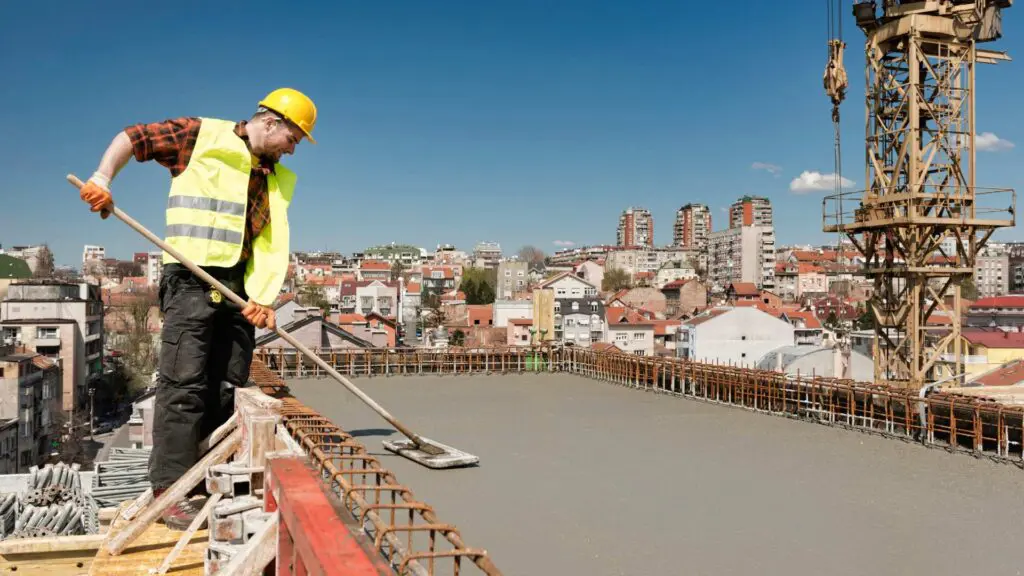 a roofer working on a concrete roof that will resist leaks
