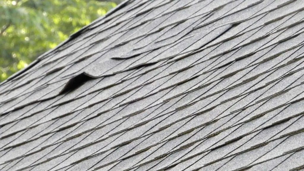 a roof with possible storm damage to the shingles