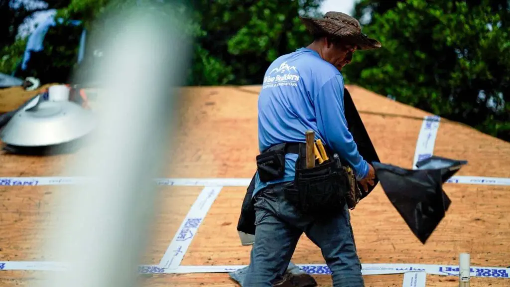 a roofer installing a shingle roof in mobile al