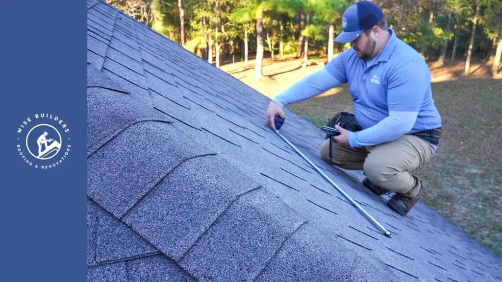 a roofer inspecting a shingle roof for leaks
