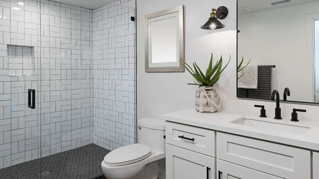 a bathroom with new tile remodeled by wise builders roofing and renovations in mobile Alabama