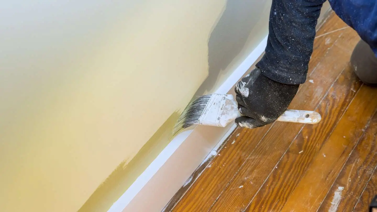 A Wise Builders painter painting trim in Mobile, Alabama